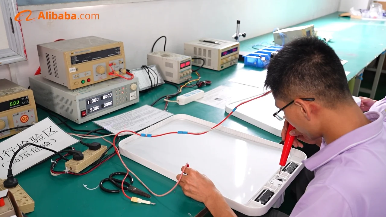 Electrical testing equipment and a lighting unit in the Zhexian factory.