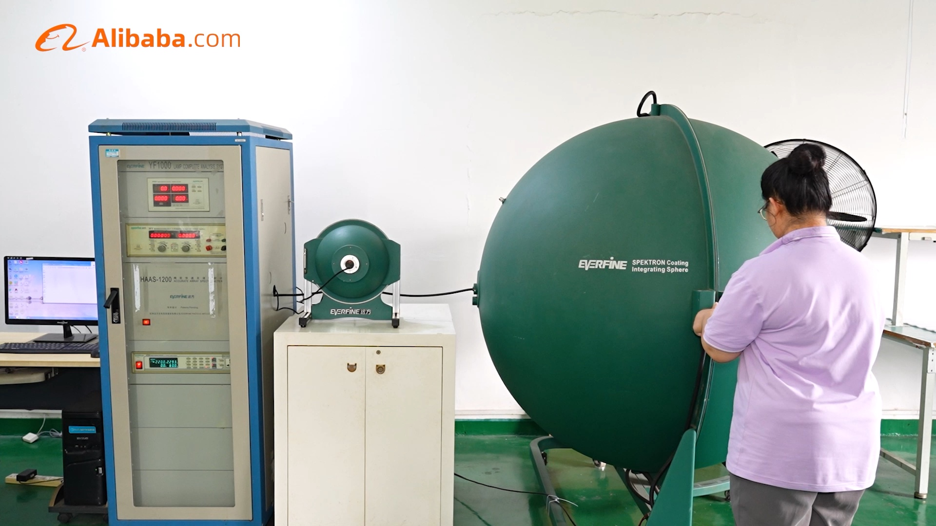 Original Zhexian photograph of an operator and integrating-sphere photometric equipment